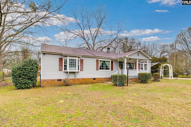 ranch-style house featuring crawl space, covered porch, metal roof, and a front lawn