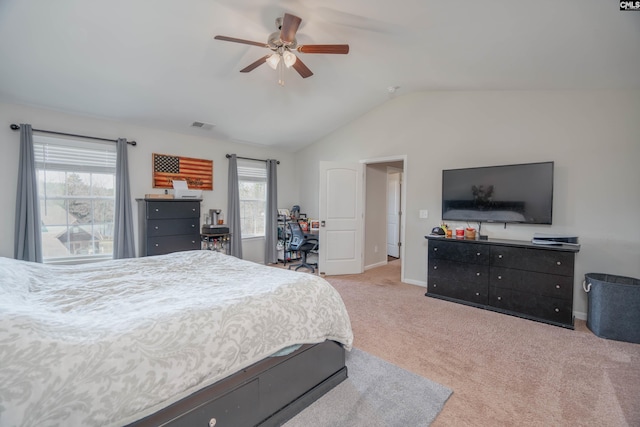 bedroom with light colored carpet, visible vents, vaulted ceiling, ceiling fan, and baseboards