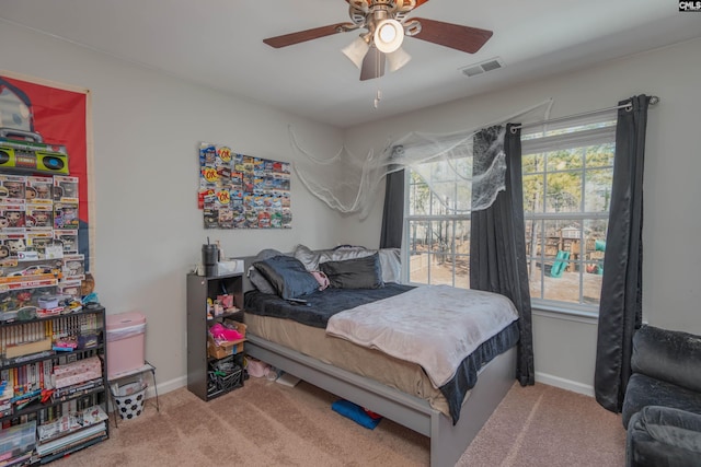 bedroom with multiple windows, carpet flooring, and visible vents