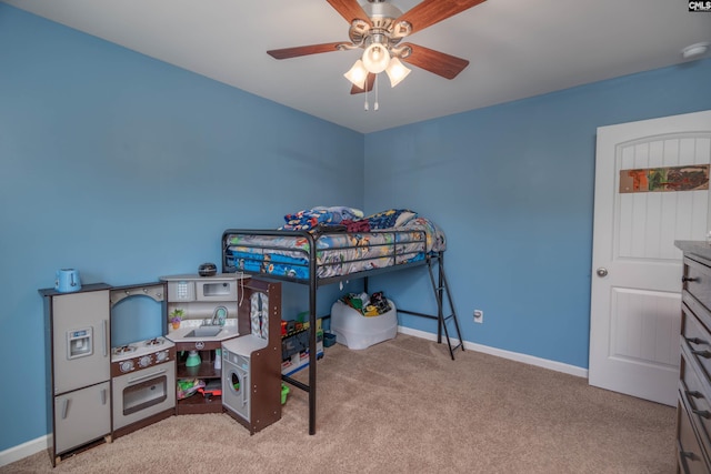 bedroom with baseboards, a ceiling fan, and light colored carpet