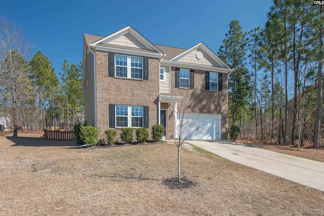 traditional-style house with a garage, fence, concrete driveway, and brick siding