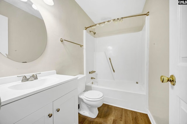 full bath with toilet, shower / washtub combination, wood finished floors, and vanity