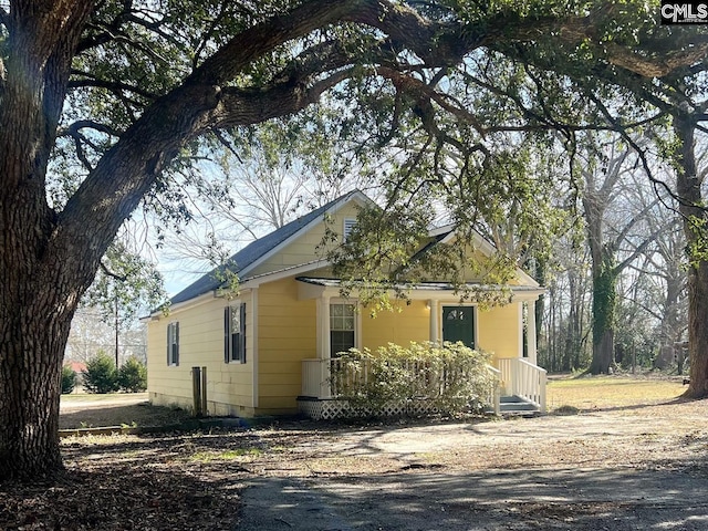 view of home's exterior with covered porch