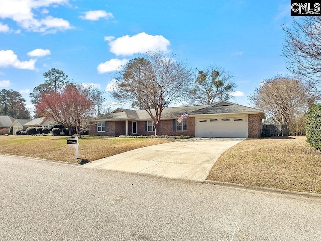 single story home with a garage, a front yard, concrete driveway, and brick siding