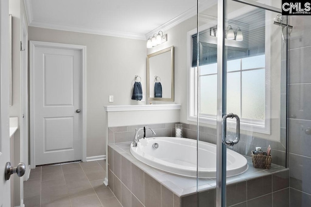 bathroom featuring tile patterned floors, crown molding, and a bath