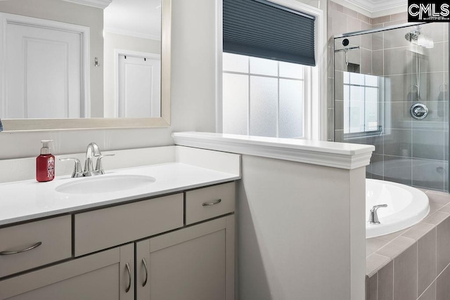 full bathroom featuring a stall shower, crown molding, vanity, and a bath