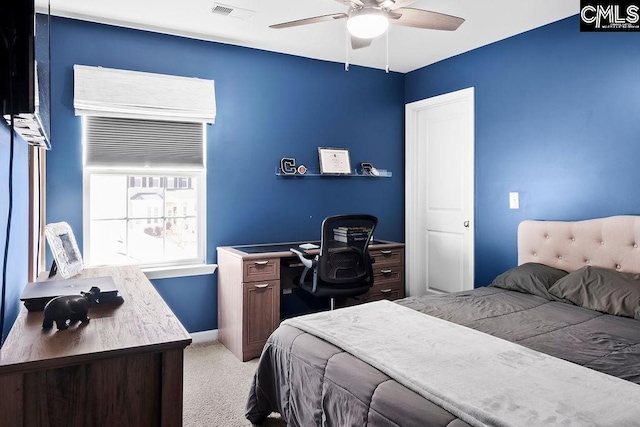 bedroom featuring a ceiling fan, light colored carpet, visible vents, and baseboards