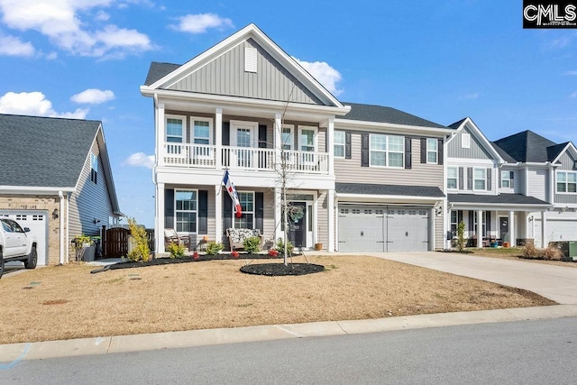 view of front of property featuring driveway, a garage, a porch, and board and batten siding