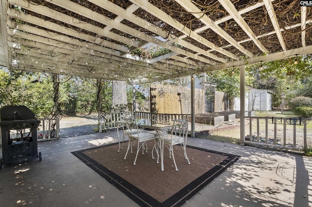 view of patio with outdoor dining area, a storage shed, an outdoor structure, area for grilling, and a pergola