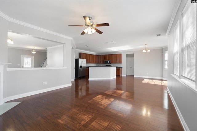 unfurnished living room featuring crown molding, dark wood finished floors, baseboards, and ceiling fan