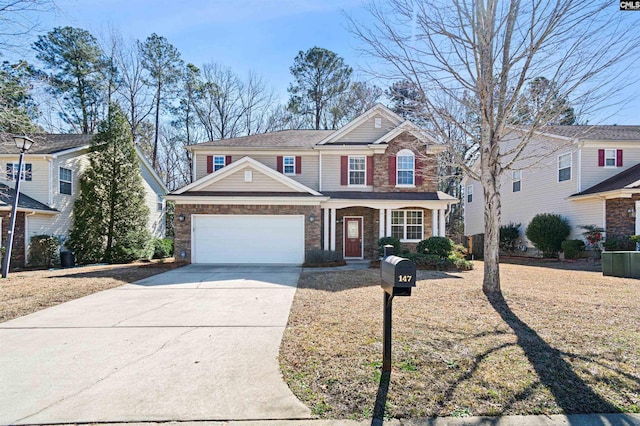 view of front of house with concrete driveway and an attached garage