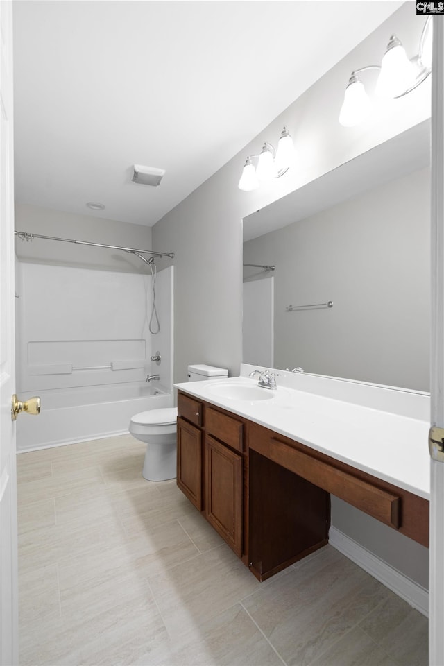 bathroom with tub / shower combination, vanity, and toilet