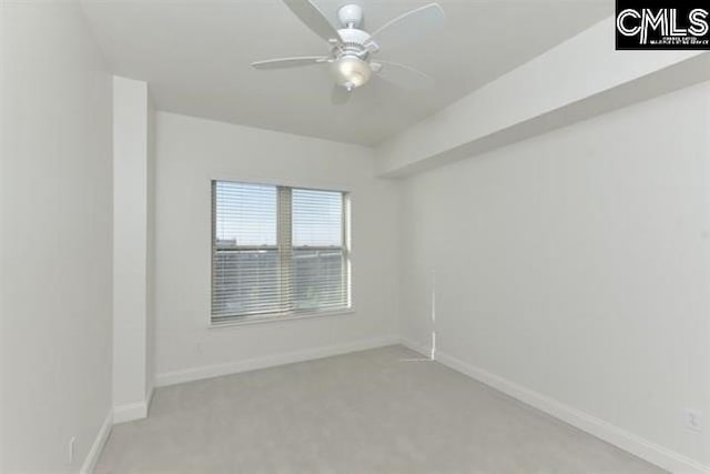 empty room with light carpet, ceiling fan, and baseboards