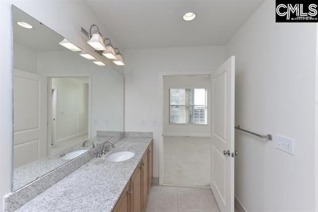 bathroom with recessed lighting, tile patterned flooring, and vanity