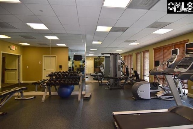 workout area featuring a paneled ceiling