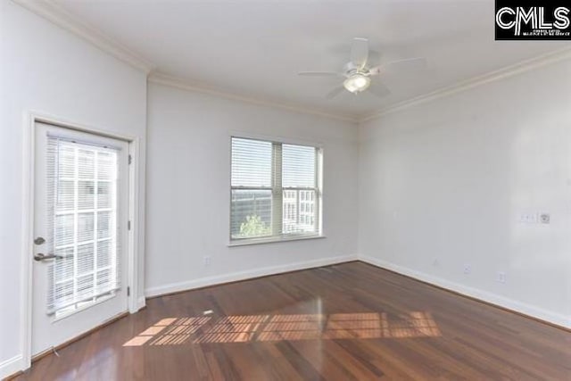 unfurnished room featuring a ceiling fan, dark wood-style flooring, crown molding, and baseboards