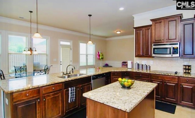 kitchen featuring pendant lighting, appliances with stainless steel finishes, and a center island