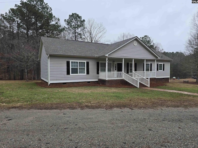 view of front of home featuring covered porch, a front lawn, crawl space, and a shingled roof