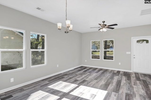 interior space with a healthy amount of sunlight, visible vents, and baseboards