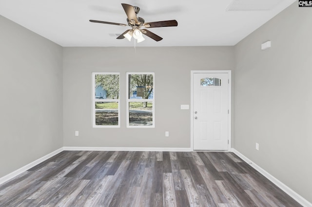 entryway with dark wood-style floors, baseboards, and a ceiling fan