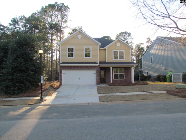 traditional home featuring a garage, cooling unit, concrete driveway, and brick siding