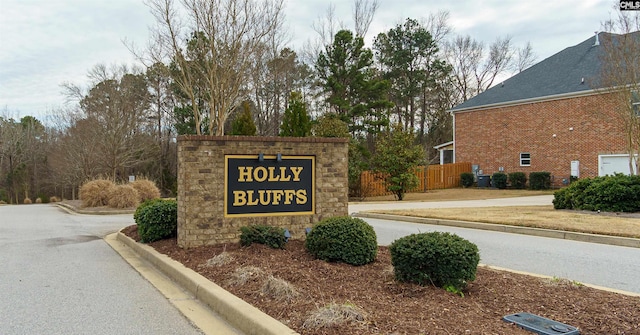 community sign with fence