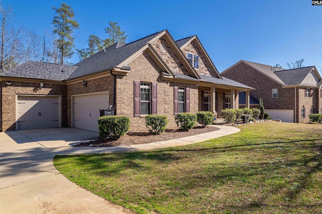 view of front of house featuring a porch, a garage, brick siding, driveway, and a front yard