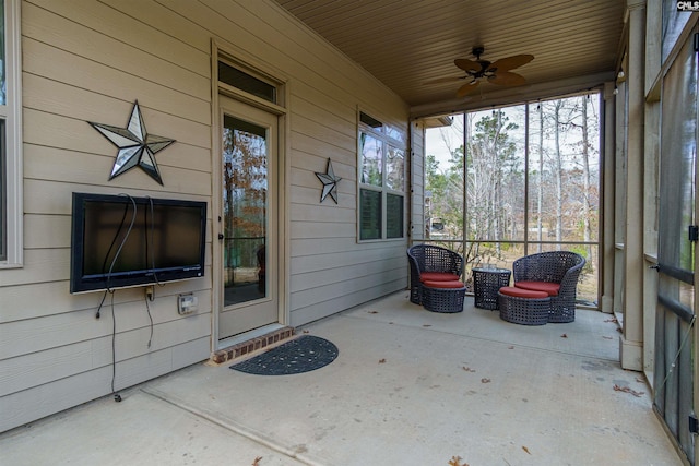 sunroom / solarium with ceiling fan