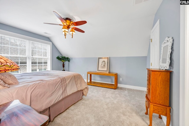 bedroom with ceiling fan, light colored carpet, visible vents, baseboards, and vaulted ceiling