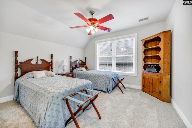 bedroom featuring visible vents, vaulted ceiling, light carpet, and baseboards