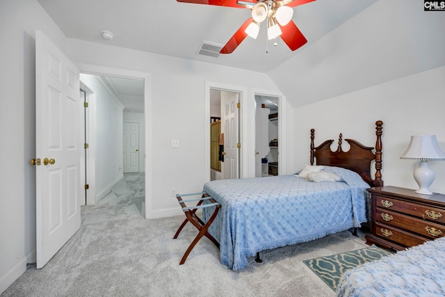 bedroom featuring lofted ceiling, light colored carpet, visible vents, attic access, and baseboards