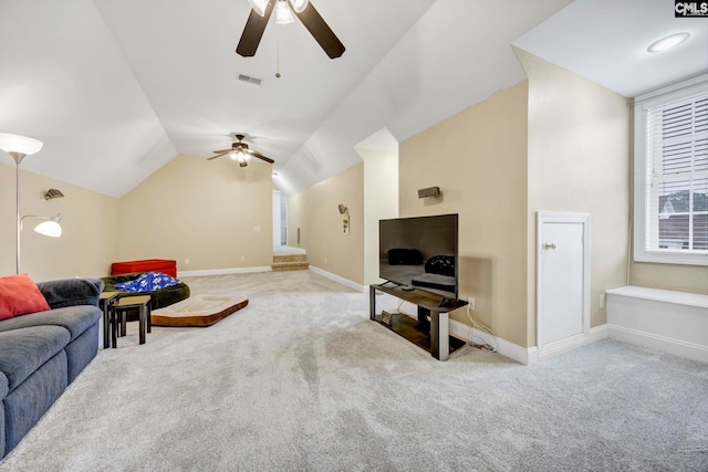 living area featuring light carpet, vaulted ceiling, visible vents, and baseboards