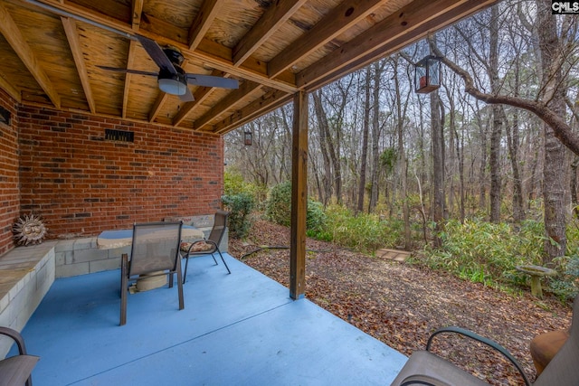 view of patio with a ceiling fan and outdoor dining space