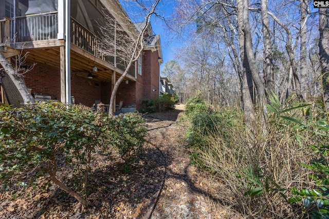 view of home's exterior with brick siding