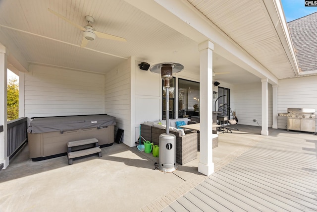 view of patio featuring a hot tub, a grill, an outdoor hangout area, and a ceiling fan