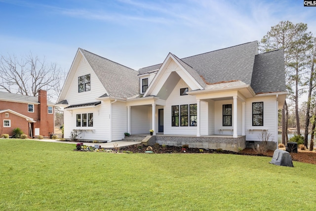 modern inspired farmhouse featuring covered porch, a shingled roof, crawl space, and a front yard