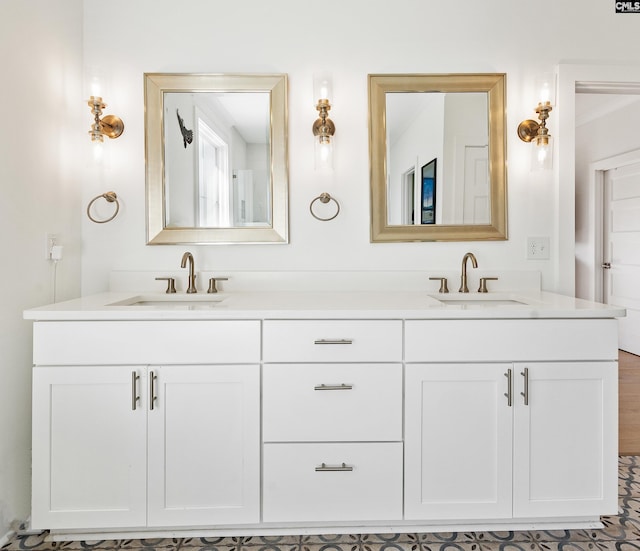 bathroom with a sink and double vanity