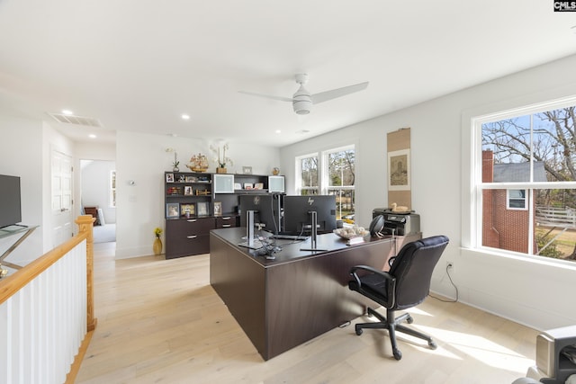 office with recessed lighting, visible vents, light wood-style flooring, a ceiling fan, and baseboards