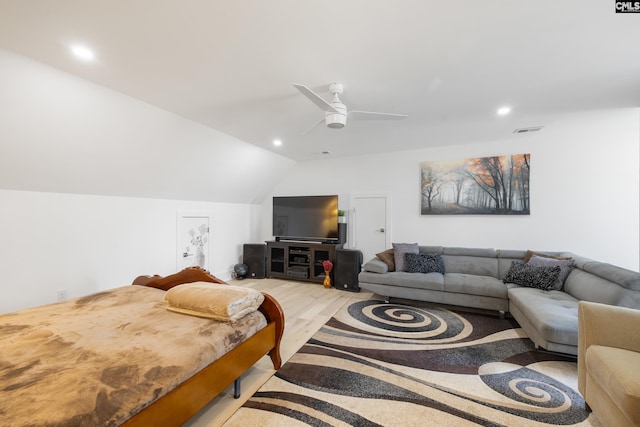 living area featuring visible vents, a ceiling fan, lofted ceiling, light wood-style floors, and recessed lighting