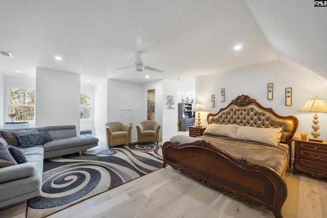 bedroom with recessed lighting, a ceiling fan, visible vents, vaulted ceiling, and light wood-style floors