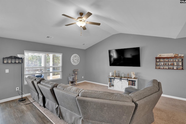 living room with visible vents, vaulted ceiling, baseboards, and ceiling fan