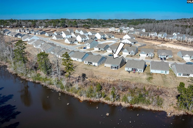 aerial view with a water view and a residential view