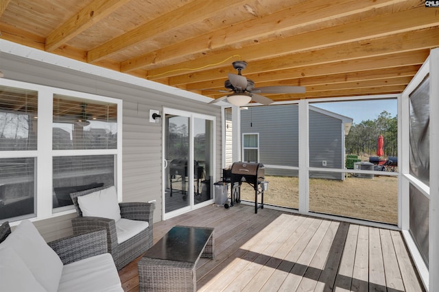 wooden terrace with ceiling fan and grilling area