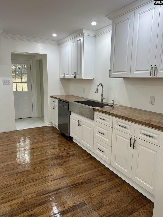 kitchen featuring dark wood-style floors, stainless steel dishwasher, wood counters, and crown molding