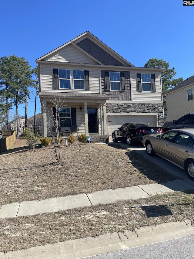 view of front of property featuring a garage, stone siding, and a porch