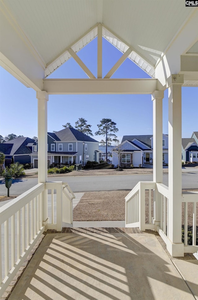 view of patio / terrace with a porch and a residential view