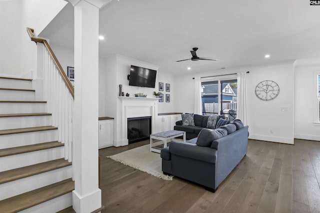 living room with stairs, wood finished floors, a ceiling fan, and recessed lighting