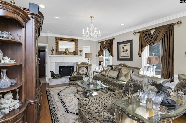 living room featuring ornamental molding, a premium fireplace, and wood finished floors