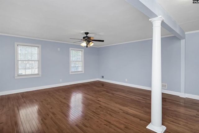 interior space with ornate columns, visible vents, dark wood-type flooring, and ornamental molding