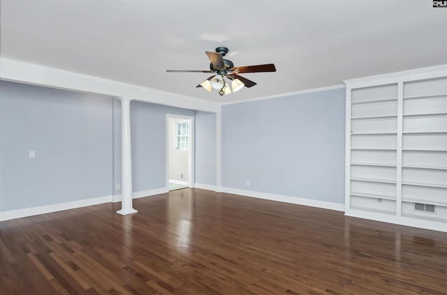 interior space with baseboards, ceiling fan, wood finished floors, crown molding, and built in shelves